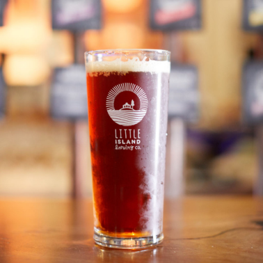 A pint of beer on a table at a bar in Perth's brewery.